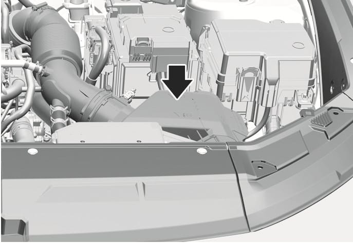 2025 Hyundai Tucson air cleaner filter location image. A large black arrow points downwards to the air cleaner housing situated in the engine compartment, connected to the air intake hose. Explains the location of the air cleaner filter for inspection and replacement.