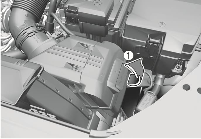 2025 Hyundai Tucson air cleaner filter replacement image. The image shows the air cleaner assembly. A callout number (1) points to the filter cover, and a curved arrow indicates the upward pulling motion. This illustrates opening the cover to replace the filter.