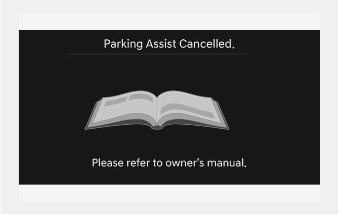 2025 Hyundai Tucson infotainment screen warning message image. The screen displays the text 'Parking Assist Cancelled.' with an open book icon in the center, and 'Please refer to owner's manual.' at the bottom. This explains the notification shown when the Remote Smart Parking Assist function is cancelled.