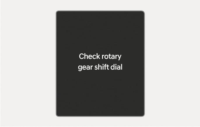 2025 Hyundai Tucson cluster display message image. The screen displays the text 'Check rotary gear shift dial' in white on a dark background. Explains the function of alerting the driver when a malfunction occurs with the rotary gear shift dial.