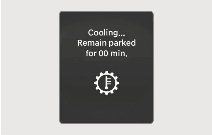 2025 Hyundai Tucson dashboard warning message image. The screen displays 'Cooling... Remain parked for 00 min.' text and a gear icon with a thermometer. This explains the function of warning the driver to wait for the transmission to cool down.
