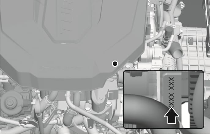 2025 Hyundai Tucson Smartstream D2.0 engine number location image. A magnified inset view displays a black arrow pointing upward to the alphanumeric code stamped vertically on the side of the engine block. Explains the location of the engine number stamped on the engine block.