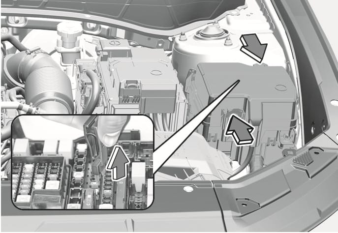 2025 Hyundai Tucson engine compartment fuse replacement image. The image displays the fuse box in the engine bay with an arrow pointing to the cover latch. An inset close-up shows a hand using a fuse puller tool to pull a fuse upward, indicated by a vertical arrow. This illustrates the procedure for opening the fuse panel and removing a fuse.