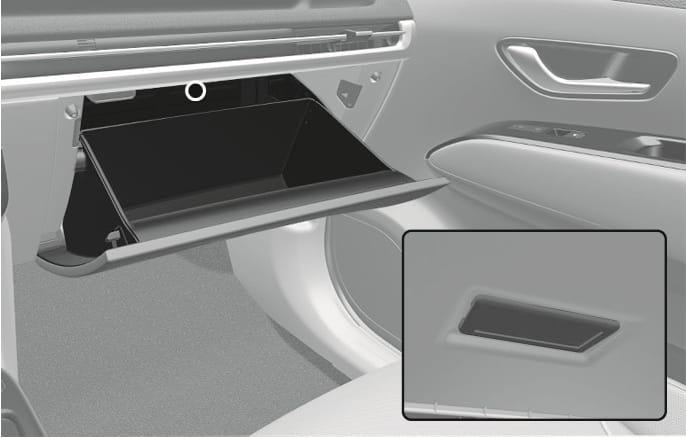 2025 Hyundai Tucson Glove box lamp image. The open glove box is shown with a white circle indicating the lamp's position at the top inside. A close-up inset details the rectangular lamp fixture. Explains the location of the light that illuminates when the glove box is opened.