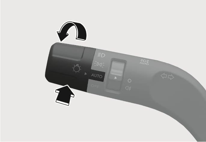 2025 Hyundai Tucson High Beam Assist control lever image. The headlight lever is displayed with the rotary switch set to 'AUTO'. A curved black arrow indicates pushing the lever forward, and a straight black arrow indicates pulling it backward. This illustrates the operation to activate the High Beam Assist function.