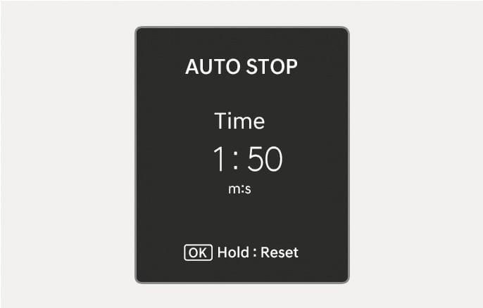2025 Hyundai Tucson Auto Stop display image. The screen shows 'AUTO STOP', 'Time', and '1:50 m:s' indicating elapsed time. The bottom displays '[OK] Hold : Reset'. It explains the feature showing the elapsed time of engine stop by the Idle Stop and Go system.