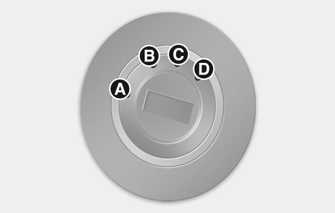 2025 Hyundai Tucson Key ignition switch image. The switch displays positions labeled (A) LOCK, (B) ACC, (C) ON, and (D) START arranged clockwise. Explains the key positions for locking the wheel, using accessories, and starting the engine.