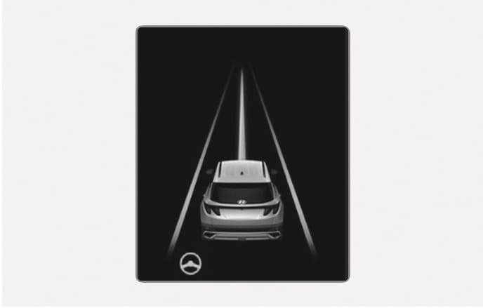 2025 Hyundai Tucson Lane detected display image. A vehicle is shown between two white lane lines on the cluster with a steering wheel icon. This explains the function where the system detects lanes and assists steering to center the vehicle.