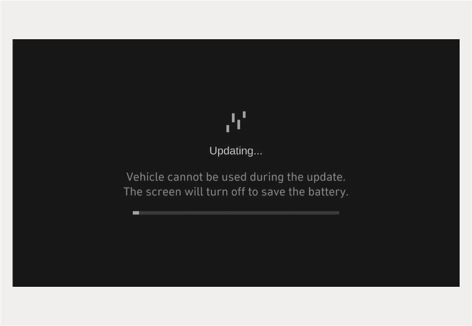 2025 Hyundai Tucson OTA software update screen image. The screen displays the text 'Updating...' and the message 'Vehicle cannot be used during the update. The screen will turn off to save the battery.' above a progress bar. This explains the screen display during the software update process.