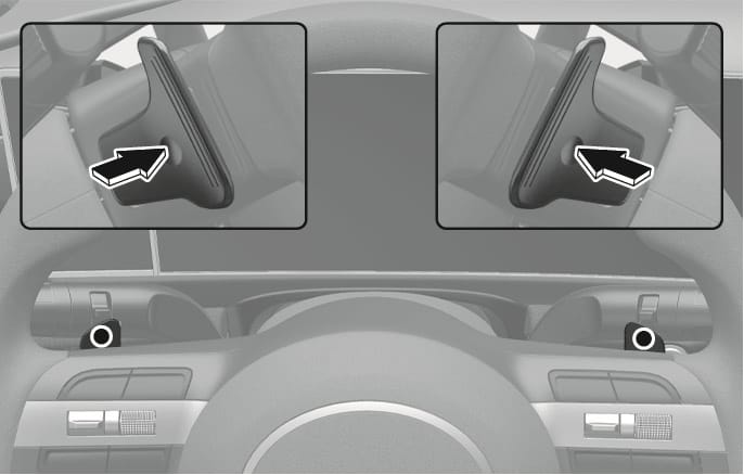 2025 Hyundai Tucson Paddle shifter image. The image shows paddle shifters behind the steering wheel. Close-ups show black arrows indicating the pulling direction towards the driver. Explains the function of manually shifting gears.
