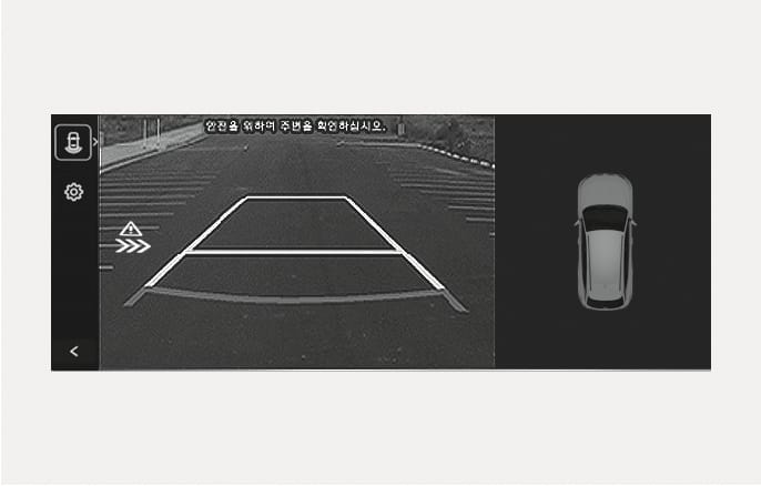 2025 Hyundai Tucson Rear Cross-Traffic Collision-Avoidance Assist warning screen image. The infotainment screen displays the rear view with a warning icon featuring an exclamation mark and arrows on the left, indicating a vehicle approaching from the side. Explains the collision warning function when reversing.