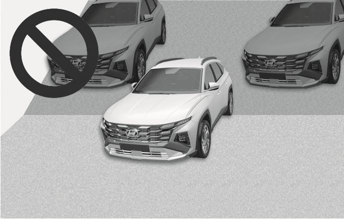 2025 Hyundai Tucson Remote Smart Parking Assist limitation image. A white vehicle is depicted on an inclined surface with a large prohibition symbol, while two grey vehicles are parked on the flat ground above. This explains the restriction that the system should not be used when parking on inclines.