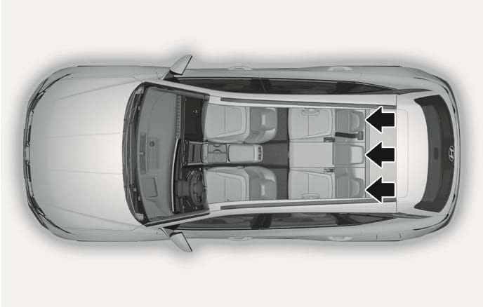 2025 Hyundai Tucson rear seat headrests location image. A top-down view shows three black arrows pointing to the headrests on the left, center, and right rear seats. Explains the location of the headrests equipped in all rear seating positions.