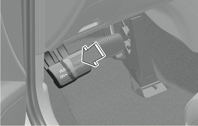 2025 Hyundai Tucson foot-type parking brake pedal image. A large arrow points diagonally downward, indicating the motion to depress the pedal located on the left side of the footwell. The pedal surface displays the text 'PUSH ON <-> OFF'. Explains the function of applying or releasing the parking brake by pushing the pedal.