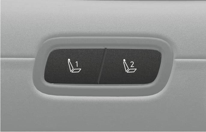 2025 Hyundai Tucson Integrated Memory System buttons image. Two buttons labeled with seat icons and the numbers 1 and 2 are displayed side by side. Explains the function of storing and recalling the driver's seat position settings.