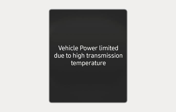 2025 Hyundai Tucson cluster display warning message image. The screen displays the text 'Vehicle Power limited due to high transmission temperature' in white letters on a black background. This explains the warning indicating that the vehicle's power output is restricted due to transmission overheating.