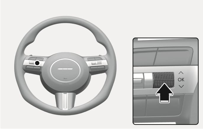2025 Hyundai Tucson steering wheel OK button image. It shows the steering wheel and a close-up of the OK scroll switch with vertical arrows. A black arrow points to the switch, indicating the press action. Explains the function of pressing the OK button to deactivate the Rear Occupant Alert.