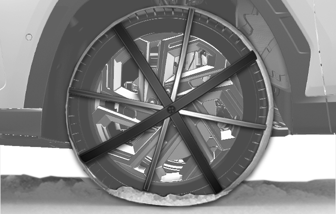 2025 Hyundai Tucson Fabric-type tire chain image. The image displays a fabric-type snow chain installed on the tire, with straps crossing the wheel spokes. This illustrates the use of fabric chains recommended for aluminum wheels to provide traction on snowy or icy roads.