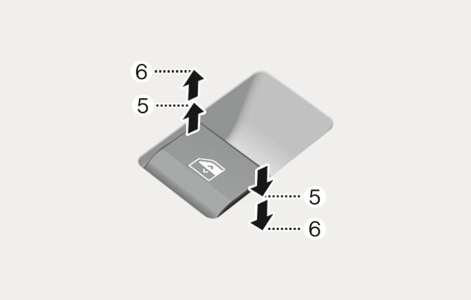 2025 Hyundai Tucson power window switch operation image. Upward and downward arrows indicate switch movement, with callout (5) marking the first detent position and callout (6) marking the second detent position. This explains the function of controlling manual and auto window operations by pressing or pulling the switch to different levels.