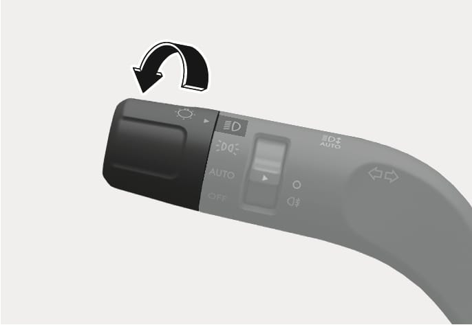 2025 Hyundai Tucson lighting control lever image. A curved black arrow indicates rotating the end knob. The knob is aligned with the headlight icon. Icons for position light, AUTO, and OFF are visible on the lever. Explains the function of rotating the switch to turn on the headlights.