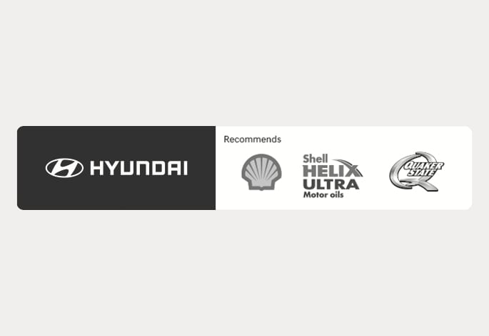 2025 Hyundai Tucson recommended engine oil brands image. It displays the Hyundai logo on the left and the text 'Recommends' alongside logos for Shell, Shell Helix Ultra, and Quaker State on the right. This illustrates the engine oil brands recommended for the vehicle.