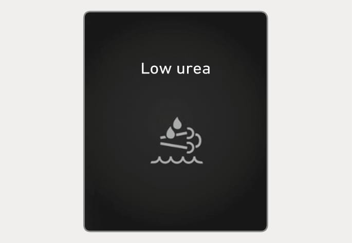 2025 Hyundai Tucson Low urea warning message image. The instrument cluster displays the text 'Low urea' above a white icon representing the exhaust fluid system. This alerts the driver that the urea level is low and should be refilled as soon as possible.
