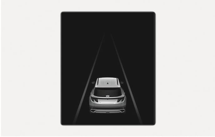2025 Hyundai Tucson Cluster Driving Assistance View screen image. A vehicle rear view and converging lane graphics are displayed in the center of a black background. Describes the function to visually check the operation status of driver assistance systems such as Smart Cruise Control and Lane Keeping Assist.